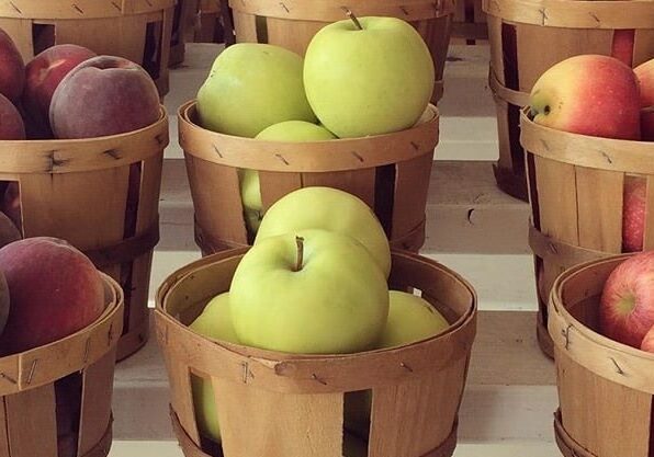 apples in baskets by Michele K